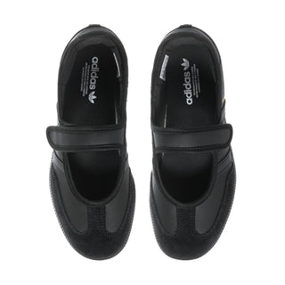 Pair of black Mary Jane sneakers showing front openings and adidas branding