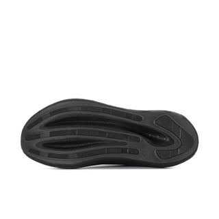 Men's black sneaker outsole with tread pattern and molded traction pods