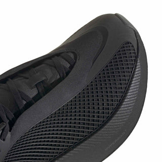 Close-up of men's black sneaker side with textured mesh and lace-up