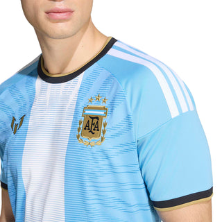 Close-up of light blue and white striped jersey with gold emblem and black neckline
