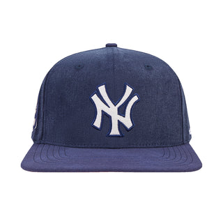 Navy Yankees strapback cap with white embroidered NY logo on the front panel