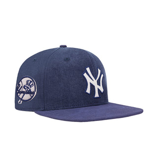 Navy Yankees strapback cap with side NY logo and circular team patch