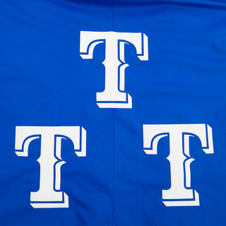 Close-up of large white Texas T design on blue T-shirt