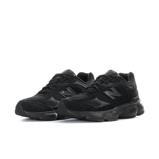 Black athletic sneakers, lace-up mesh with oversized rubber sole, side-by-side