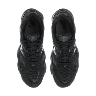 Black lace-up athletic sneakers, top view with textured mesh and N logo