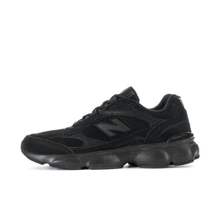Black lace-up athletic sneaker with N logo and chunky outsole