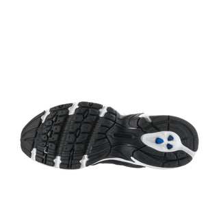 Women's wide sneakers outsole view with tread pattern and blue heel accent