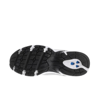Wide sneaker outsole view with textured traction tread and dark heel with blue accent