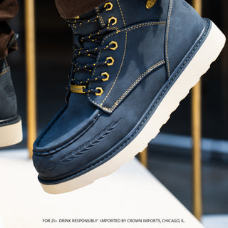 Men's navy lace-up boots with gold eyelets, beige sole and padded collar