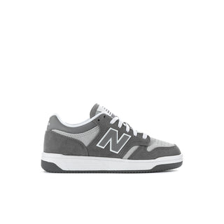 Kids New Balance sneakers, front-left side in gray with large N logo