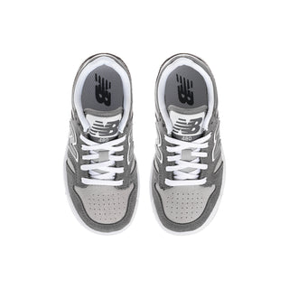 Kids New Balance sneakers, top view with white laces and gray uppers