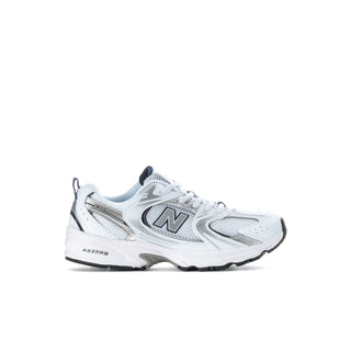 Kids' New Balance 530 sneakers, angled front view in white with navy accents