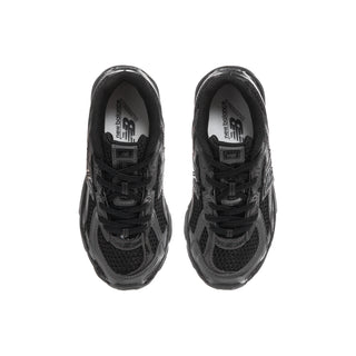 Kids' black running shoe pair with lace-up vamp and padded collar detail