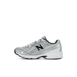 Kids silver metallic running shoes with black trim, lace-up front, and N logo