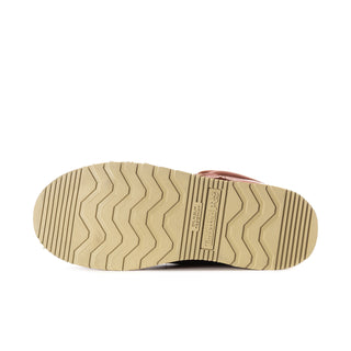 Men's rust boot outsole with textured tread and brand label on the heel.