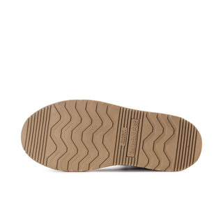 Beige tread sole of rust-brown lace-up work boot with rugged pattern