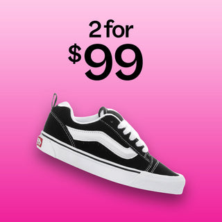 Black and white Vans sneaker with “shop 2 for $99” text.