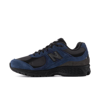 Men's 2002R sneakers, side view with blue overlays, black toe, and N logo