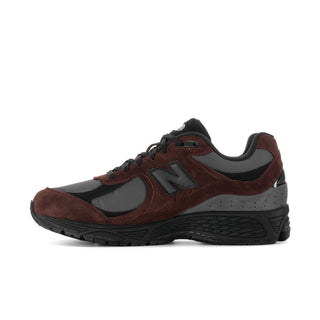 Men's sneakers, angled side view, dark brown suede with black toe and gray details