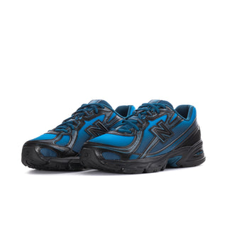 Men's New Balance lace-up sneakers, blue upper with black details and chunky sole.