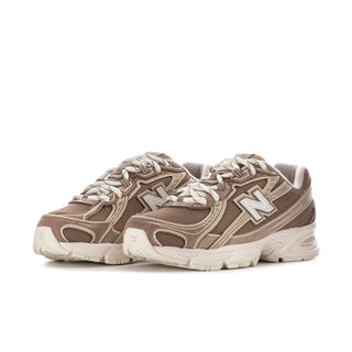 Women's running sneakers, beige-brown uppers with large N logo and white laces.
