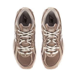Women's lace-up sneakers with beige-brown patterned uppers and cushioned collar lining.