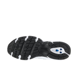 Women’s sneaker outsole view with black tread pattern and blue logo detail