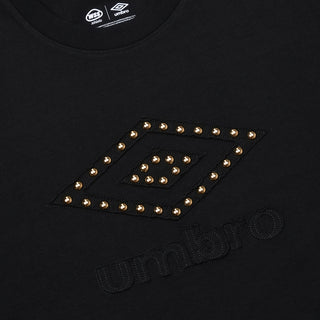 Close-up of black T-shirt chest logo with studded eye graphic and Umbro text