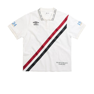 White mens polo shirt with ribbed collar, button placket, Umbro logo and diagonal stripe