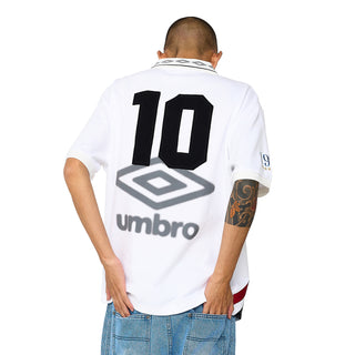 White polo shirt back with large number 10 graphic and Umbro logo