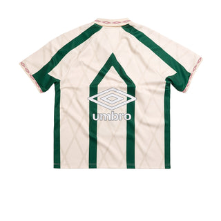 Men's off-white and green collared athletic jersey with Umbro chest logo graphic