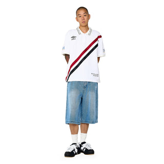Light blue denim carpenter shorts on model, front view with belt loops