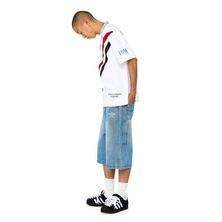 Light blue denim carpenter shorts on a model, angled side seam and pockets
