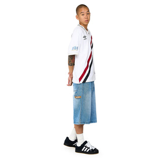 Light blue denim carpenter shorts side view with belt loops and pocket stitching