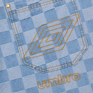 Light blue check denim pocket with orange Umbro text and emblem