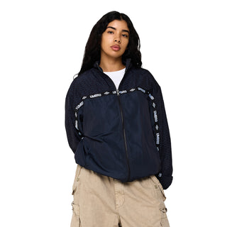 Men's black coaches jacket on model, full-zip front with Umbro branding across shoulders