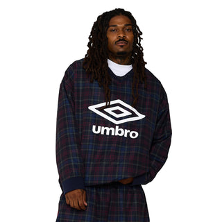 Men's plaid windbreaker with V-neck and Umbro logo, worn over a white collar.