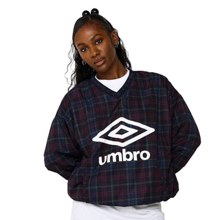 Plaid V-neck windbreaker with Umbro logo, loose fit over a white base layer.