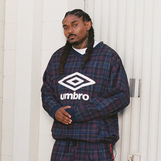 Plaid windbreaker with Umbro logo, V-neck with ribbed cuffs, dark navy check.