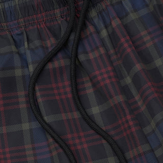 Plaid windbreaker shorts close-up, black drawstring at waistband