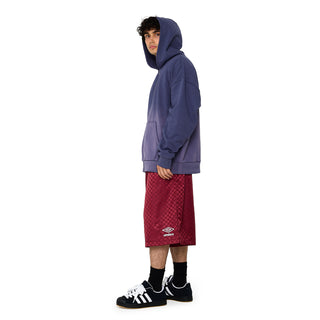Cordovan checkered nylon shorts with Umbro logo, side view