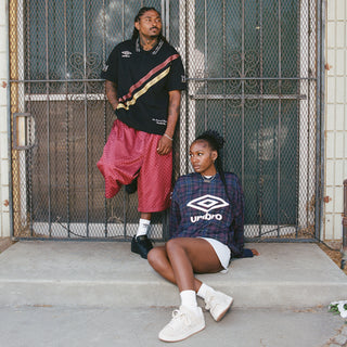 Cordovan checkered nylon shorts on model, with Umbro logo