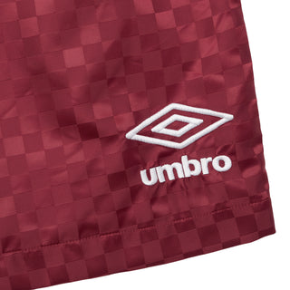 Cordovan checkered nylon shorts hem with Umbro logo patch