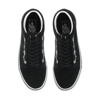 Men's black low-top sneakers, top view with black laces and Vans logo on tongue
