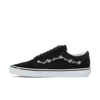 Men's black low-top sneakers with white floral embroidery on side and white rubber sole