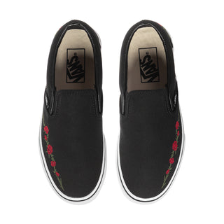 Black VANS slip-on sneakers, front/top view, with rose embroidery on uppers