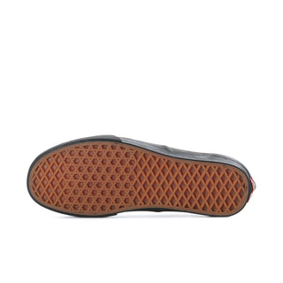 Men's black low-top sneakers with brown rubber outsole tread underside