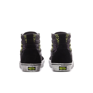 Black high-top sneakers with neon green heel tabs and white rubber cup soles
