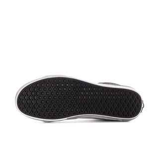 Black rubber outsole with textured tread pattern for sneakers