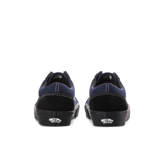 Men's low-top sneakers with navy heel accents and lace-up back collar